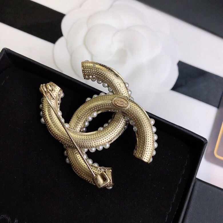 Ch**el brooches